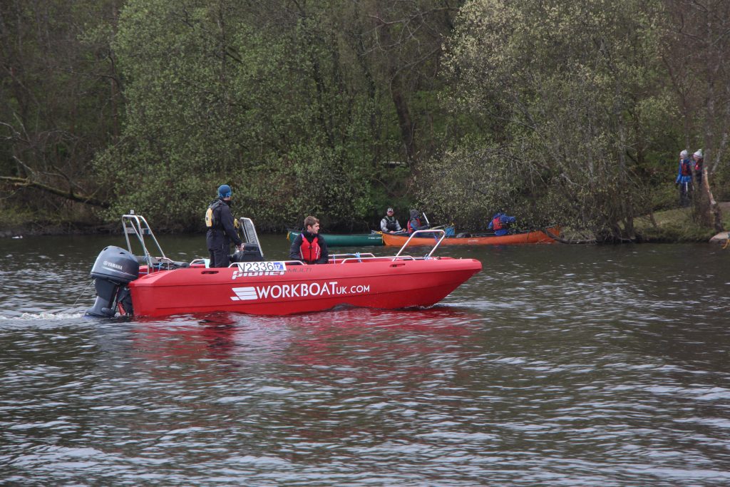 Workboat Multi supporting IYE paddlers